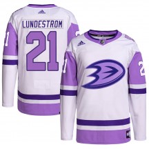 Men's Adidas Anaheim Ducks Isac Lundestrom White/Purple Hockey Fights Cancer Primegreen Jersey - Authentic